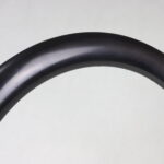 Detalle del acabado en fibra de carbono y orificios para radios de la llanta ST65 Disc de 65 mm — ST Wheels